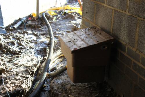 A rather ugly gas meter box outside the front door