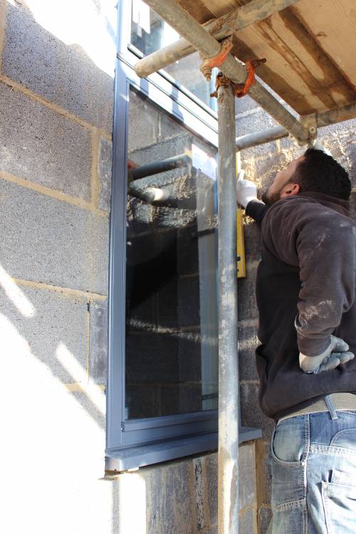 Making sure the window is straight before securing