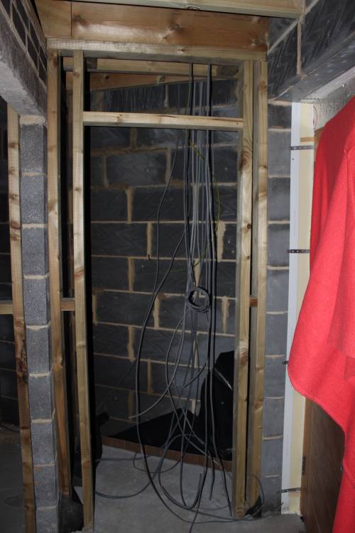 Electric cabling leading to the consumer unit in the cupboard