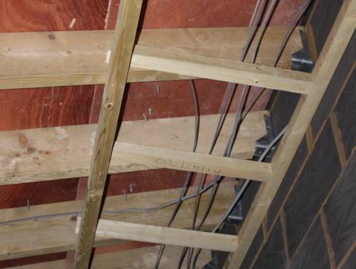 Long roofing screws inside the house