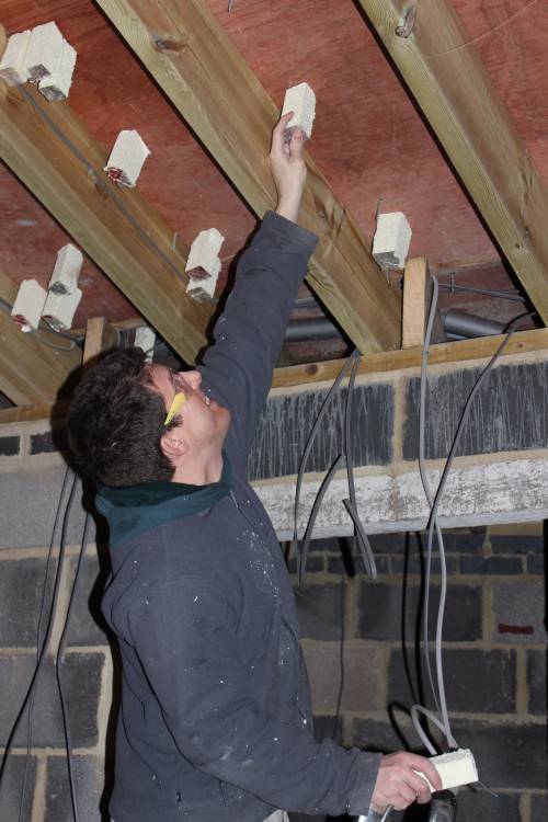 Sliding insulation blocks over each screw to prevent heat loss