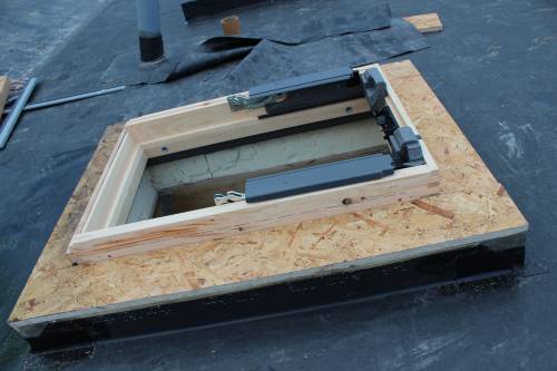 The mounted window chassis. Roof construction layers visible.