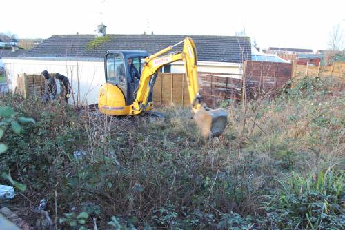 Lots of brambles, long grass and rubbish to clear