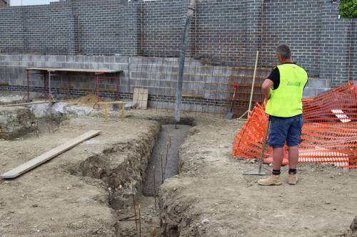 First load of concrete goes into the trenches
