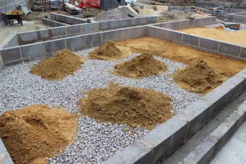 Sand waiting to be spread and compacted on the ballast