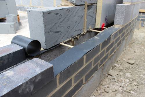 Damp proof plastic strip at Finished Floor Level