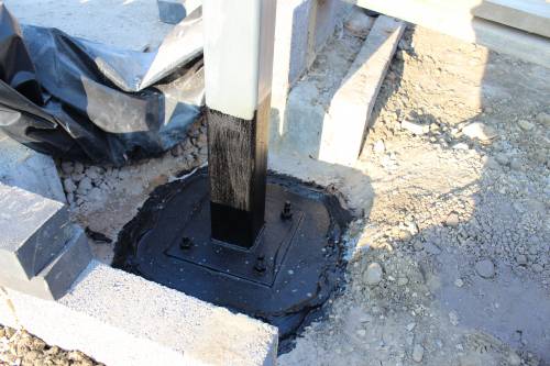 Bolted to the foundation using four bolts and resin adhesive