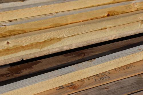 A large delivery of timber waiting to be assembled