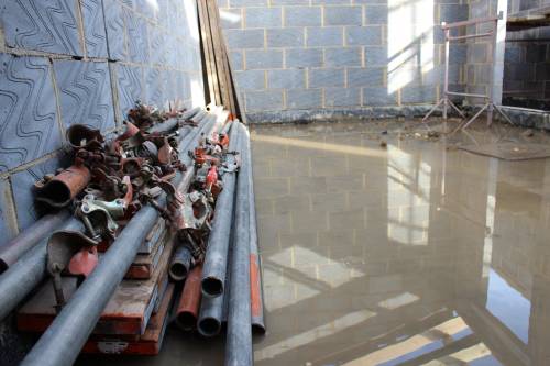 Some of the interior scaffolding removed, but still very wet under-foot